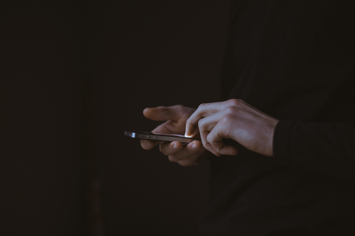 Person using a cellphone in the dark